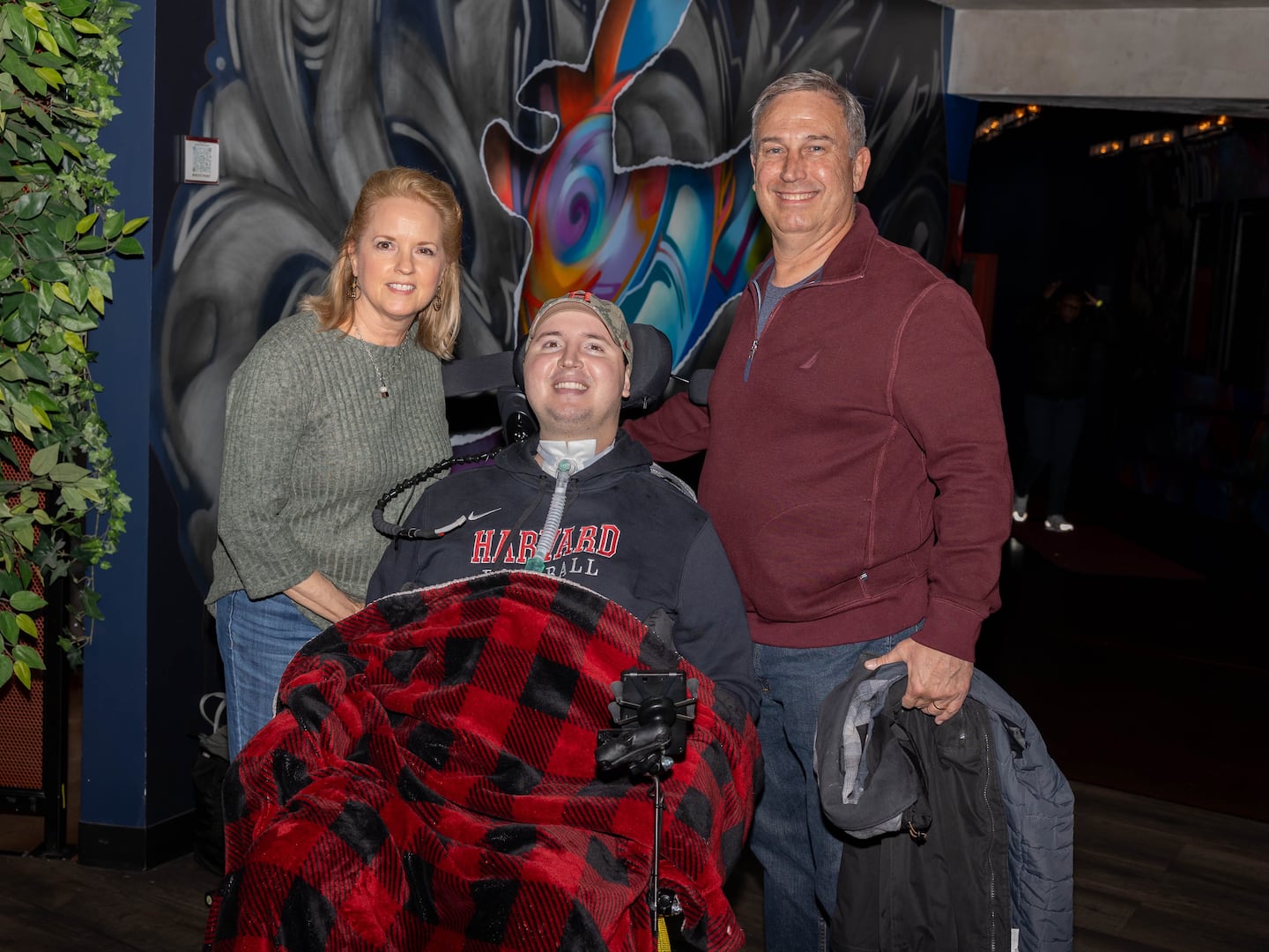 Ben (center) and his parents Sherri (left) and Marty at the 2024 Bowl for Ben event.