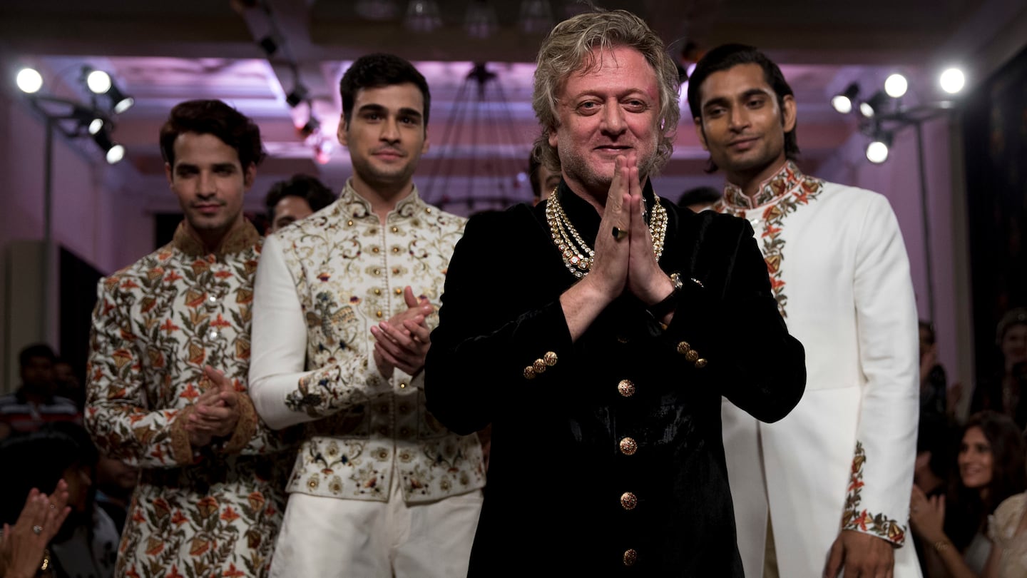 Mr. Bal acknowledged applause next to models wearing his creations at the end of his show at Couture Week 2016 in New Delhi, India, on July 24, 2016.