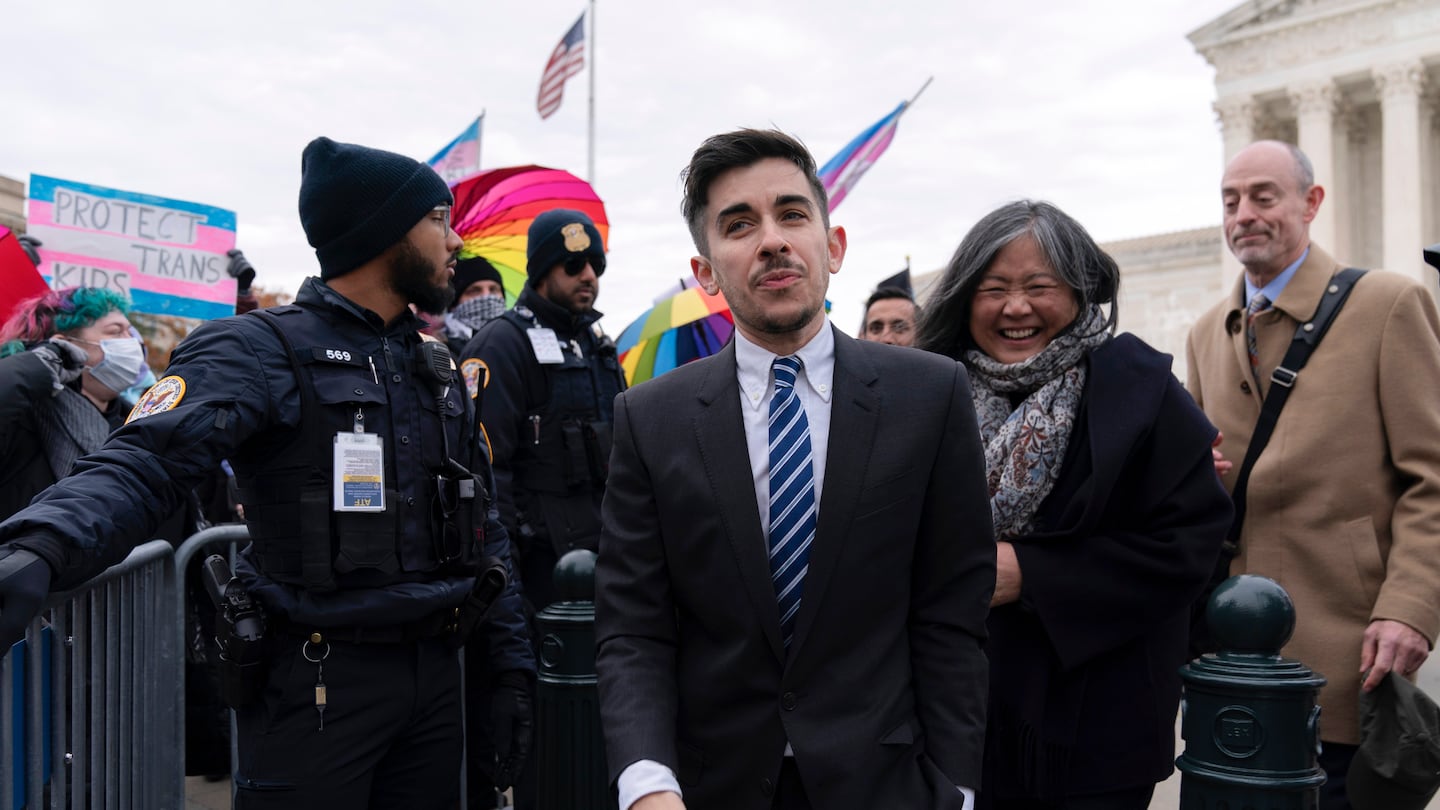 Attorney and transgender rights activist Chase Strangio greeted supporters outside of the Supreme Court on Dec. 4, in Washington.