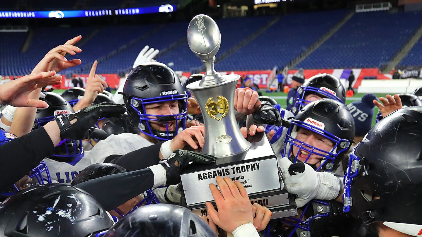 West Boylston players hoist the Agganis Trophy for the third year in a row.