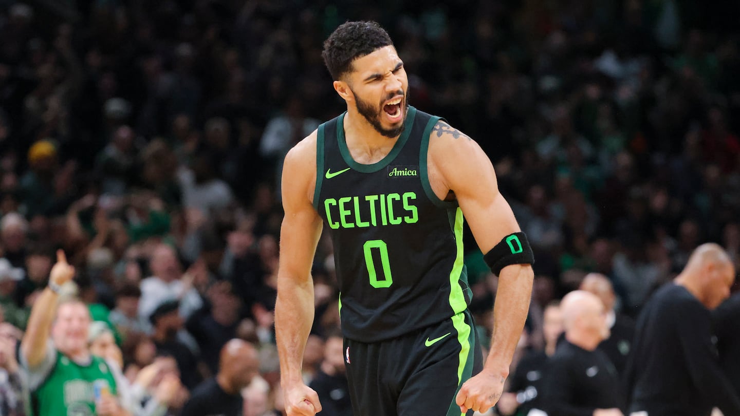 Celtics star Jayson Tatum reacts after watching Al Horford nail a huge 3-pointer late in the fourth quarter, helping send the Celtics on their way to victory over the Bucks Friday at TD Garden. 