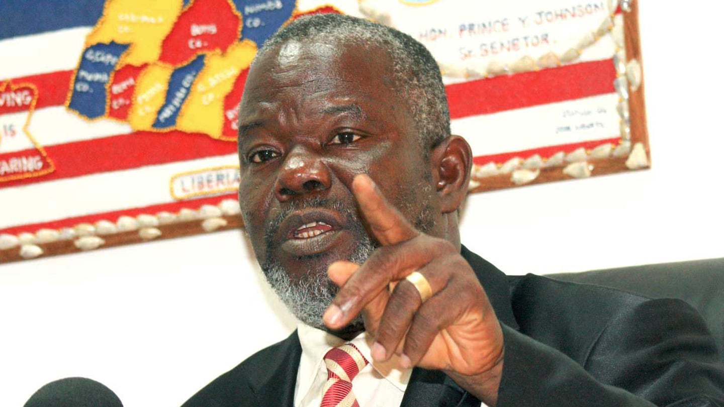 FILE - In this photo taken Wednesday Feb. 17, 2010, Liberian Senator Prince Johnson, gestures during an interview in Monrovia, Liberia. (AP Photo, File)