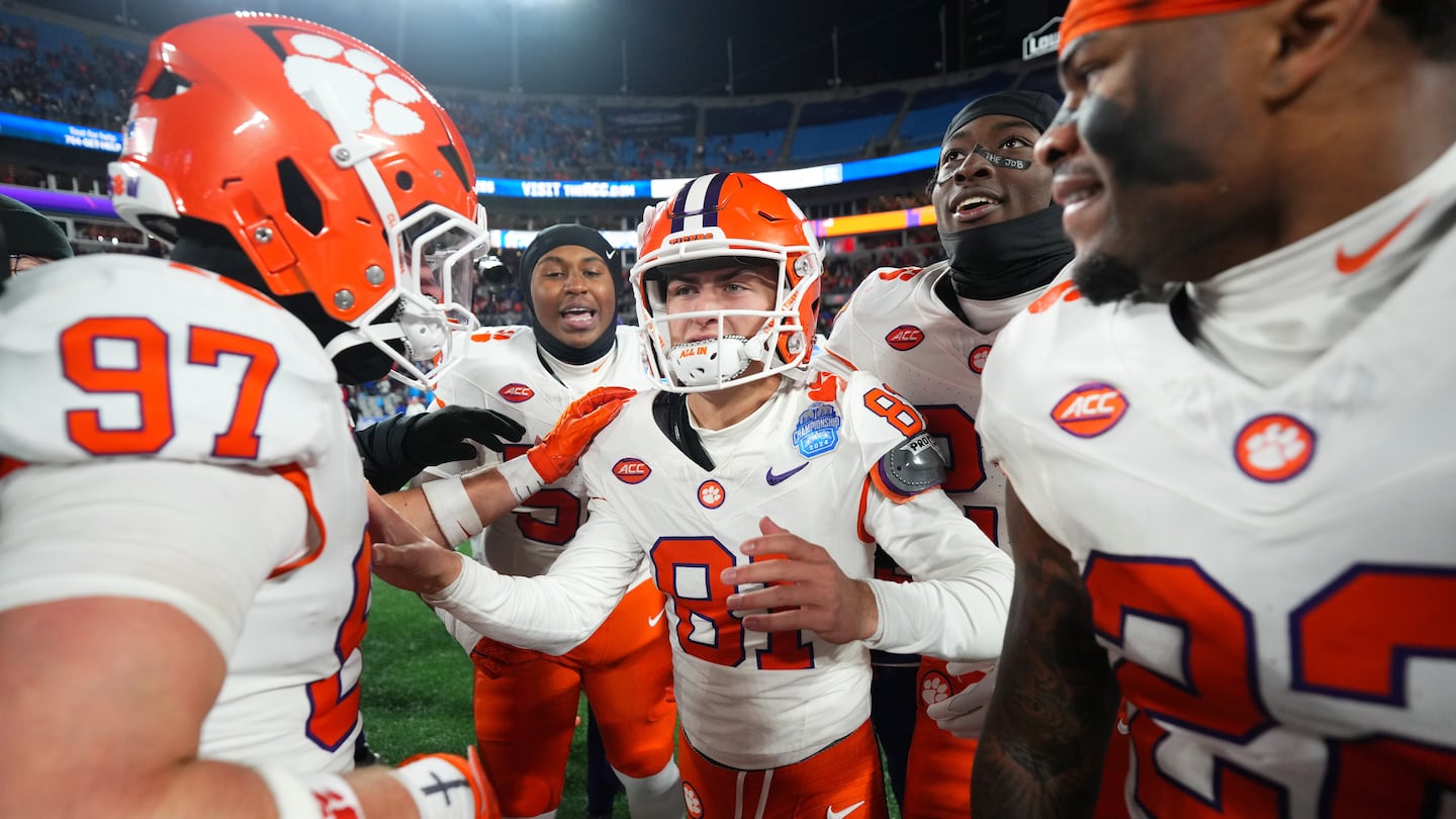 Clemson kicker Nolan Hauser (81) celebrates with teammates after kicking the game-winning 56-yard field goal in the ACC Football Championship.