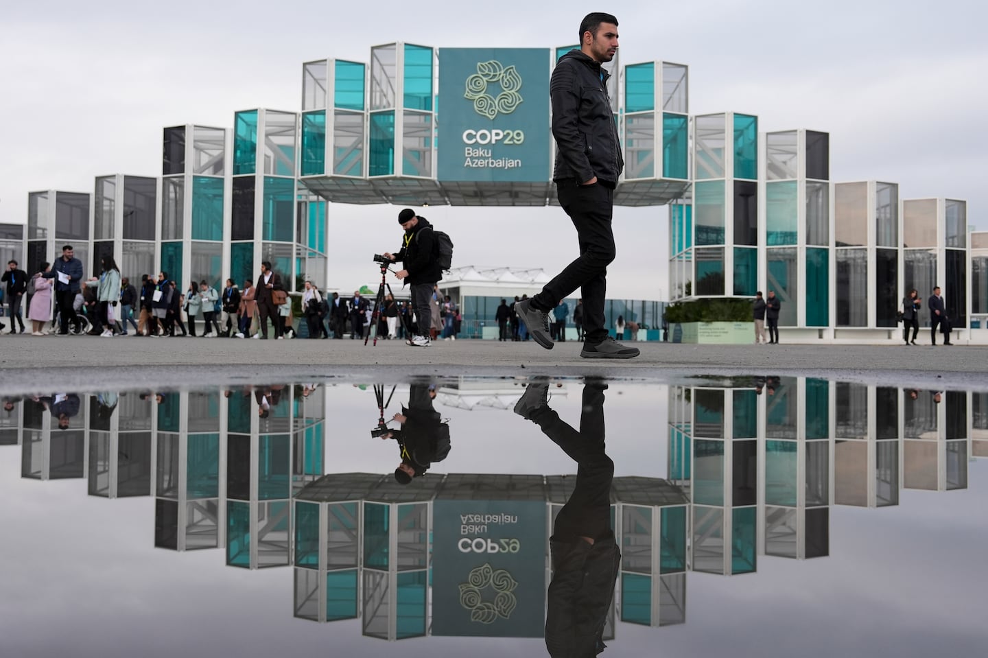 People arrive for the day at the COP29 UN Climate Summit on Nov. 19 in Baku, Azerbaijan.