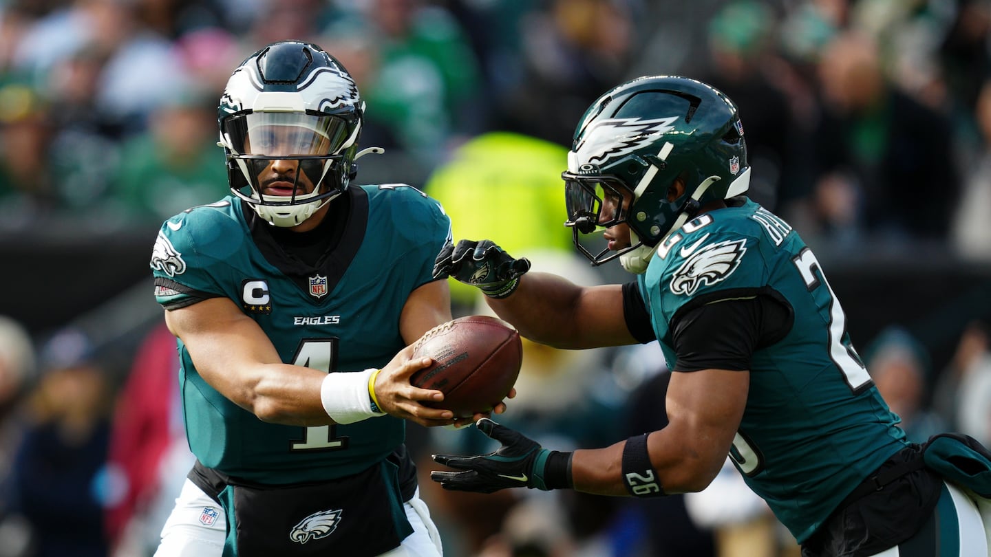 Jalen Hurts (left) and Saquon Barkley carried the Eagles to another win.