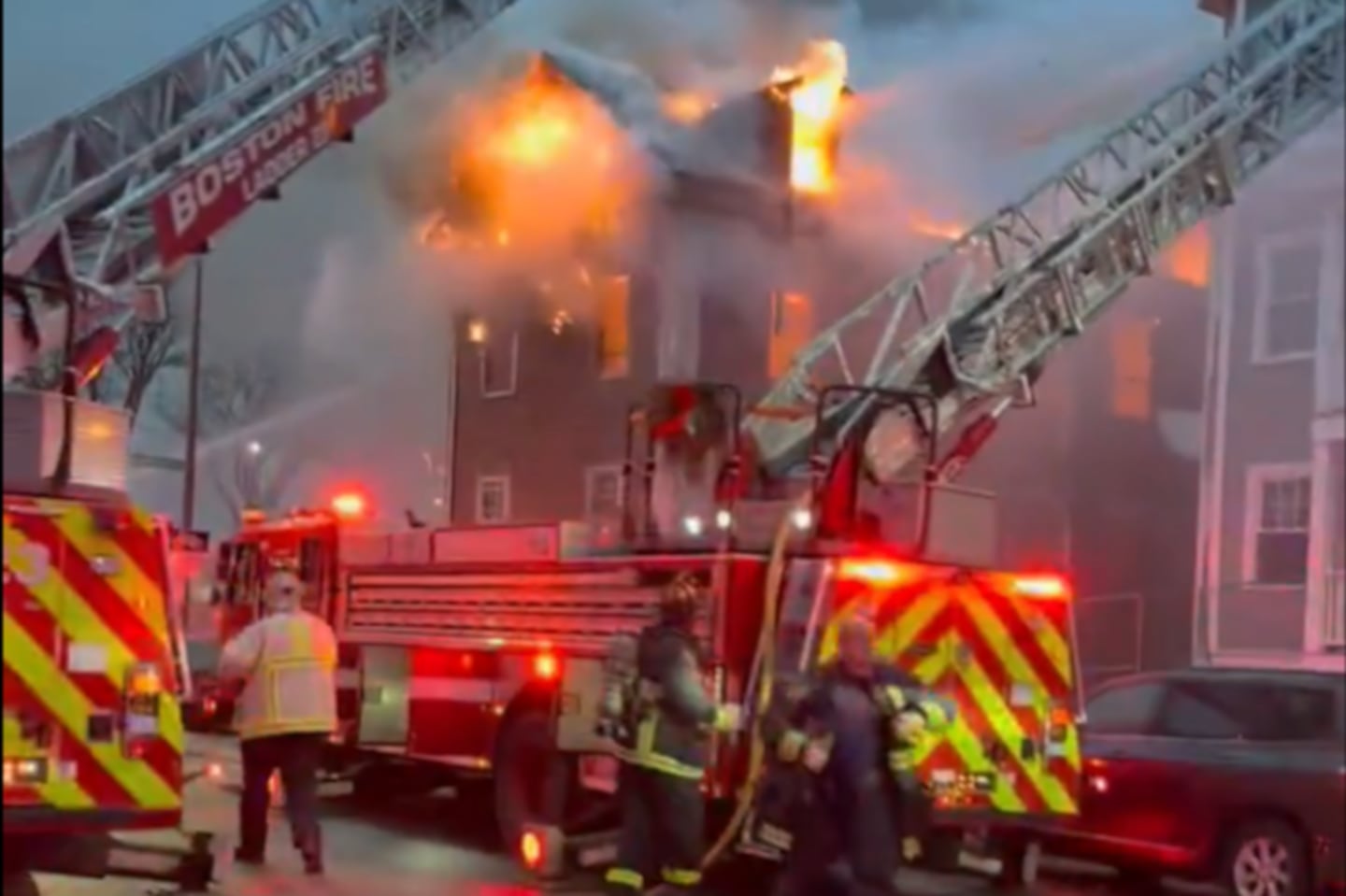 A two-alarm fire tore through a two-story home in Dorchester on Sunday morning, Boston fire officials said.