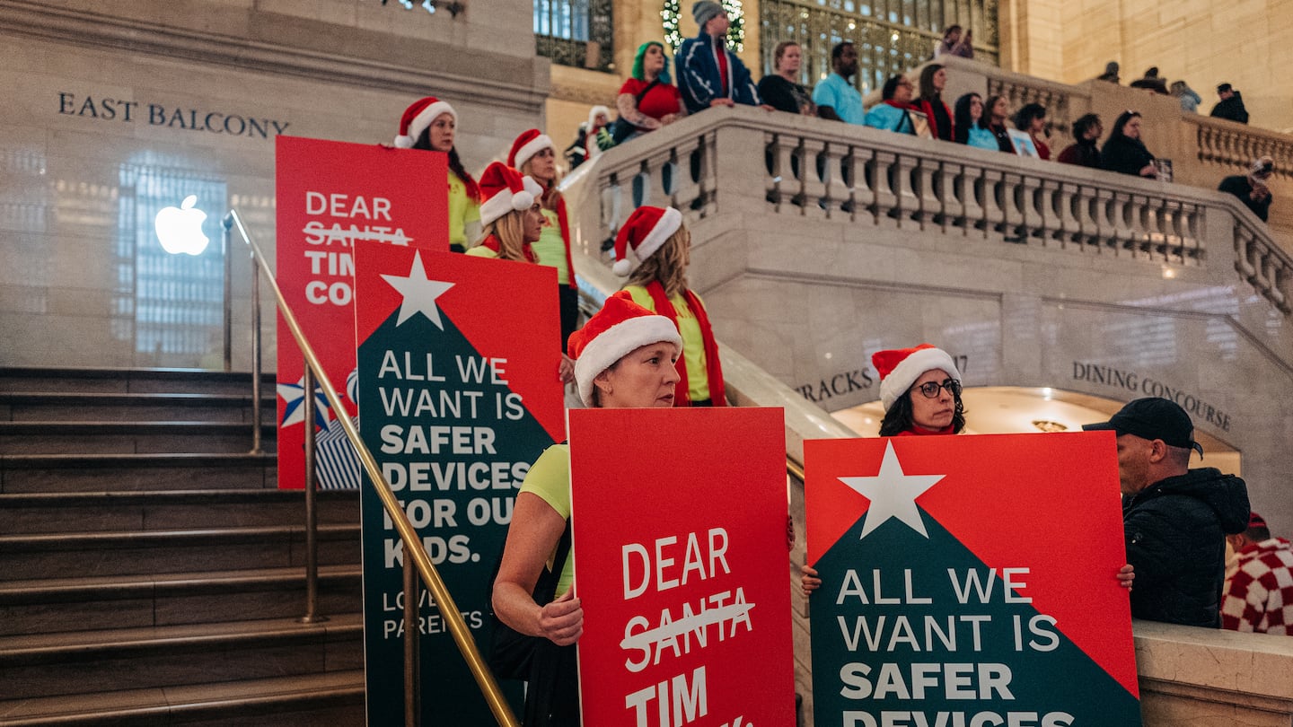 Child safety advocates demonstrates at the Apple Store in New York’s Grand Central Terminal in November.