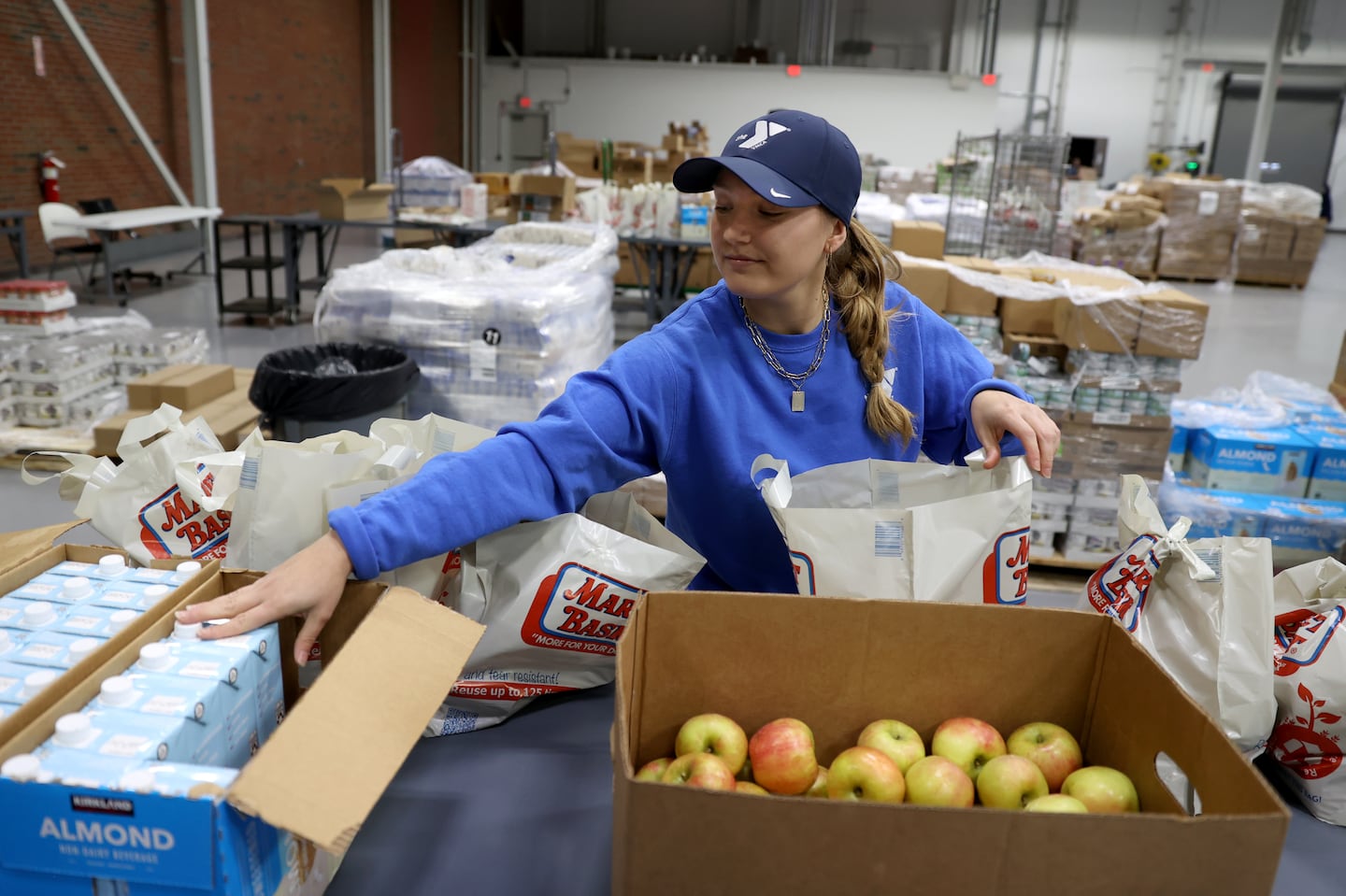 Chrissy Jarvoe sorted items inside the new facility in Roxbury.