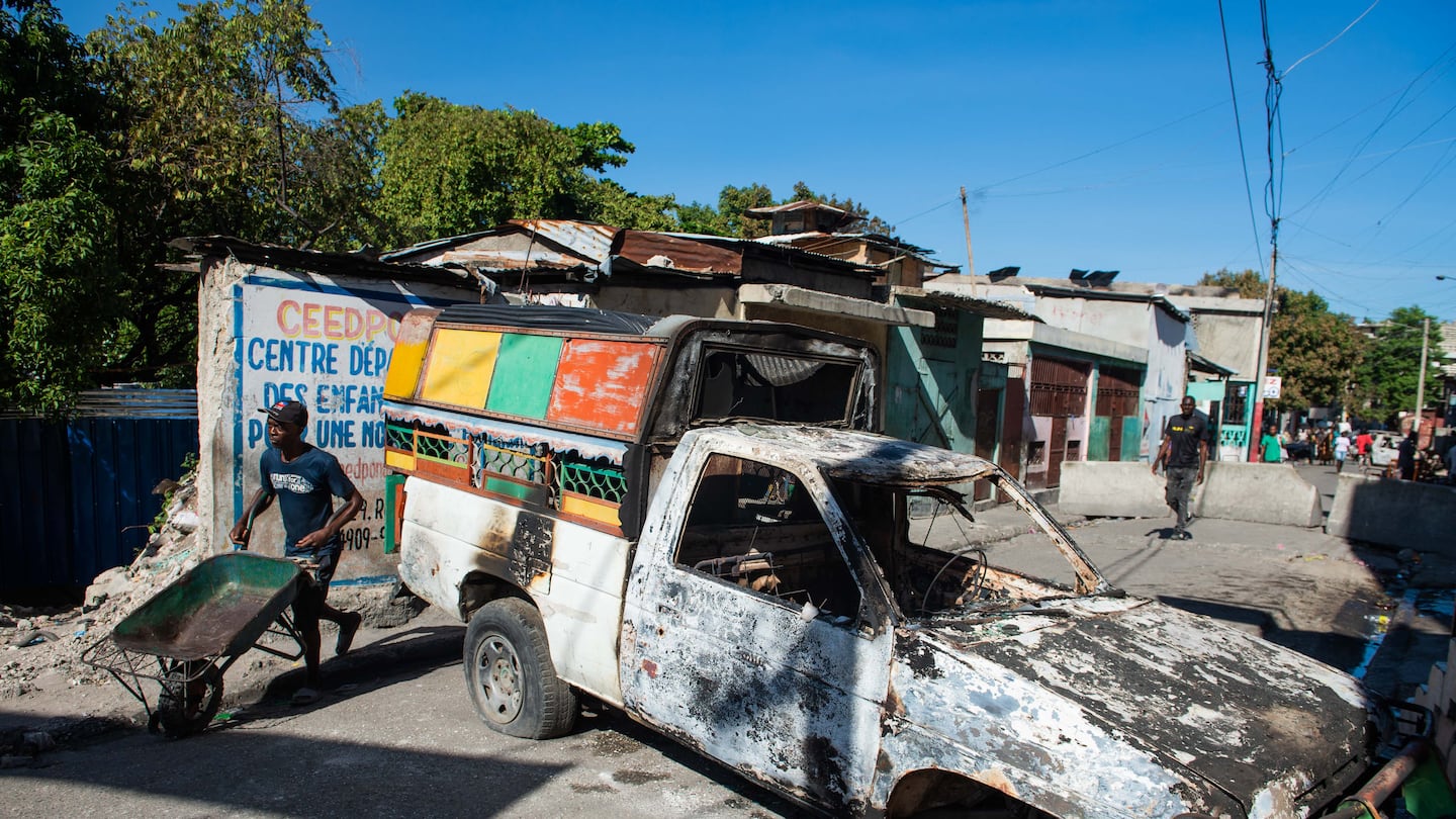 Residents evacuated Poste Marchands in Port-au-Prince, Haiti, Monday, after gangs took control of the region Saturday. Nearly 200 people in Haiti were killed in brutal weekend violence reportedly orchestrated against spiritual practitioners, with the government condemning a massacre of "unbearable cruelty."