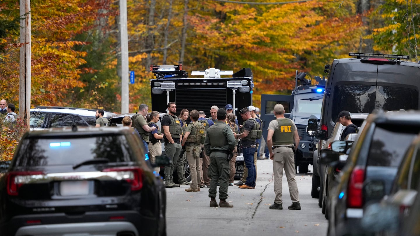 Emergency responders fill Lincoln Street Wednesday night in Lewiston, Maine, after a mass shooting. Oct. 25, 2023.