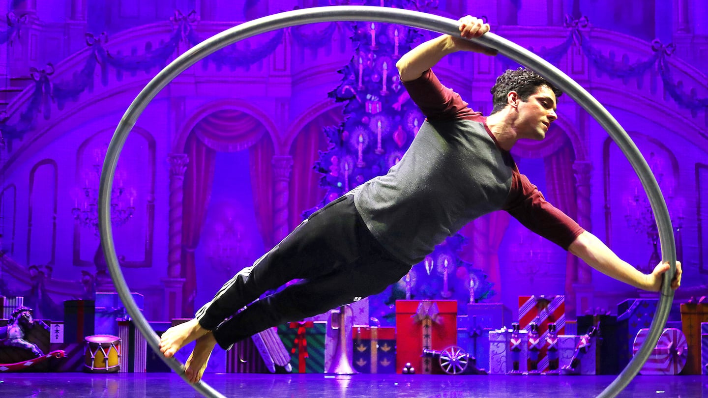 Alex Oliva, an MIT-trained engineer turned acrobat/aerialist, warms up for "NUTCRACKER! Magical Christmas Ballet" on stage at the Boch Center-Wang Theatre.