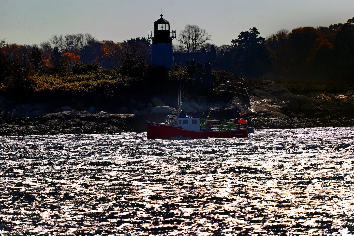 A fishing boat returns to Gloucester Harbor.