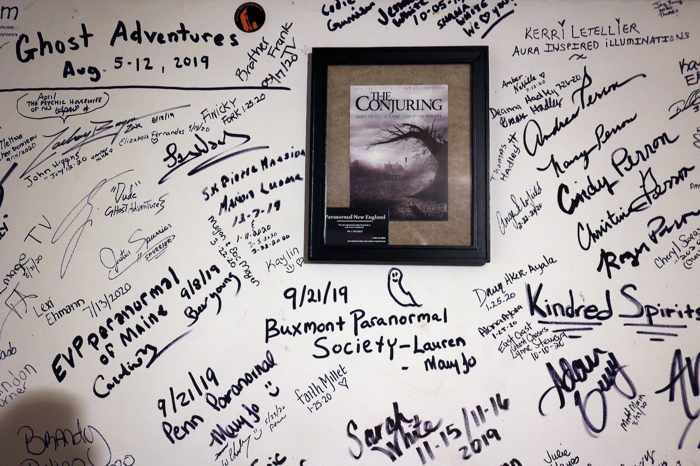 Signatures on the walls from visitors to the Conjuring House in Burrillville, R.I.