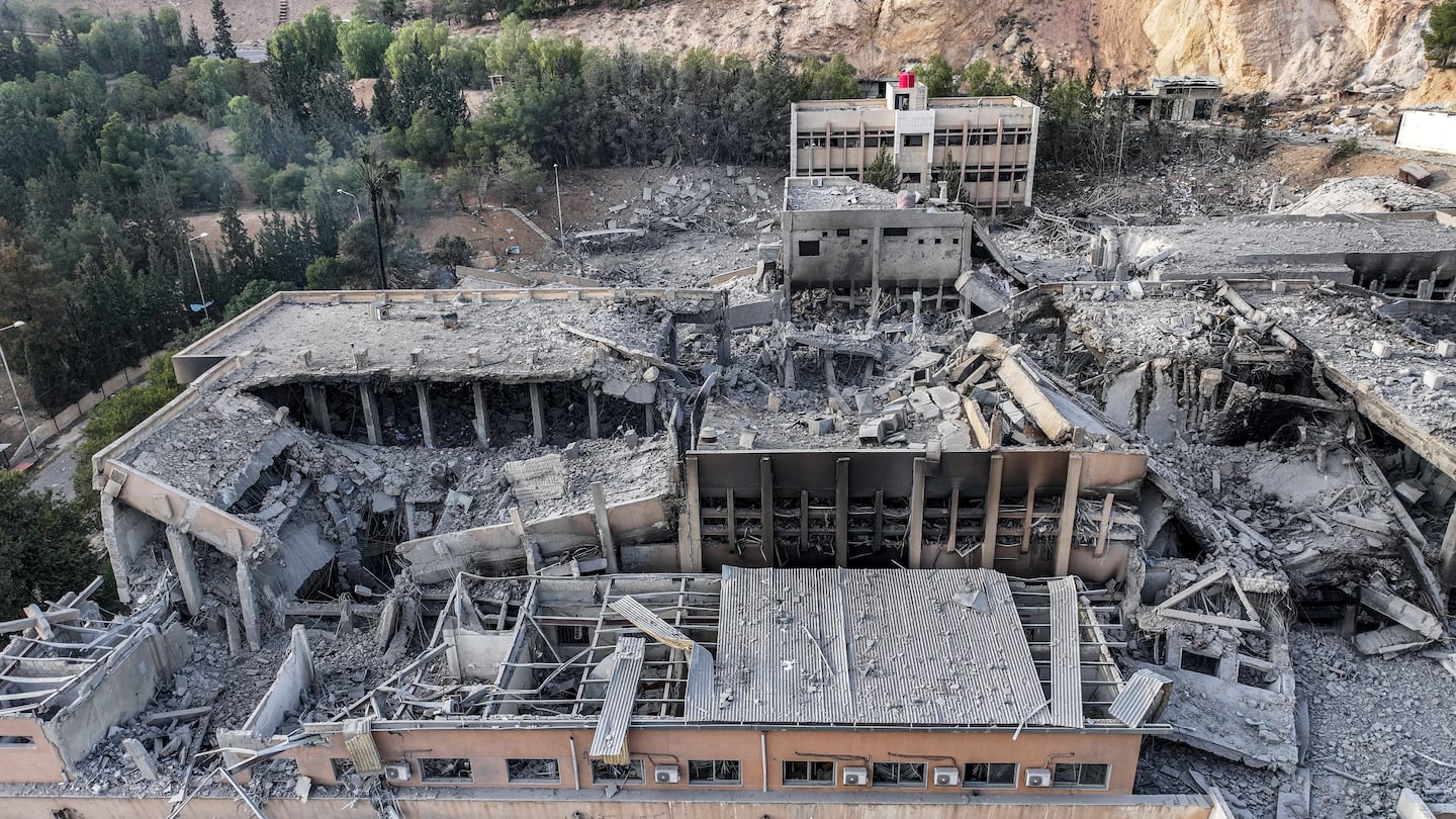 The aftermath Tuesday of an overnight strike attributed to Israel on the Barzeh scientific research center affiliated with the Syrian Defense Ministry in northern Damascus.