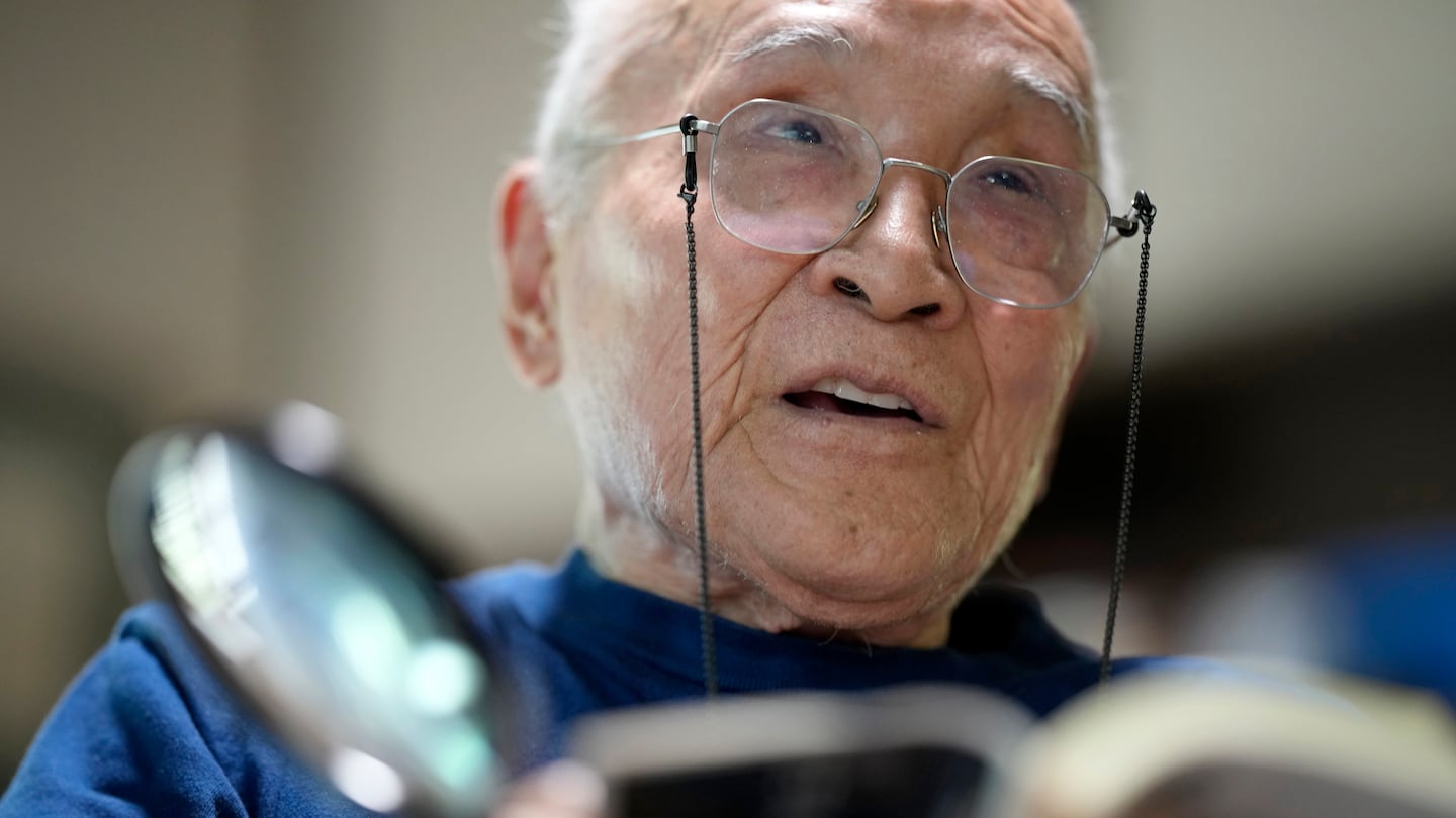 Mr. Tanikawa read a poem during an interview with the Associated Press in Tokyo in 2022.