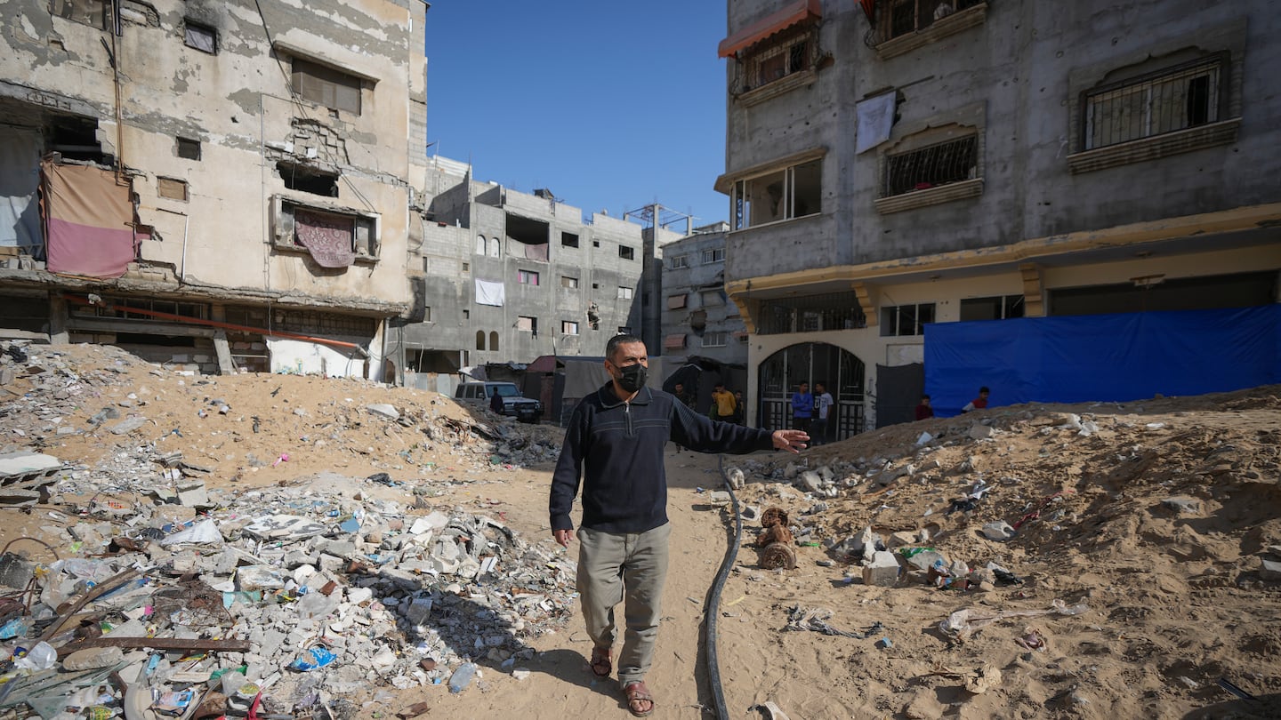 Ahmed Algharbli shows the area where he last saw his father, Mahmoud Alghrabli, in Khan Younis, Gaza Strip, on Nov. 21.