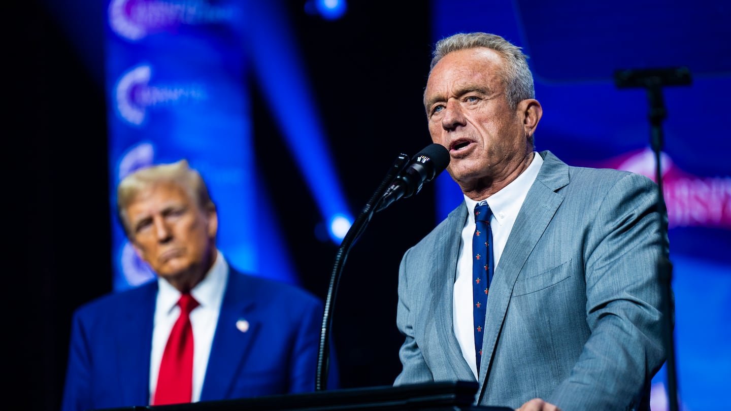 Robert F. Kennedy Jr. spoke with Donald Trump at a Turning Point Action rally in Duluth, Ga., on Oct. 23.