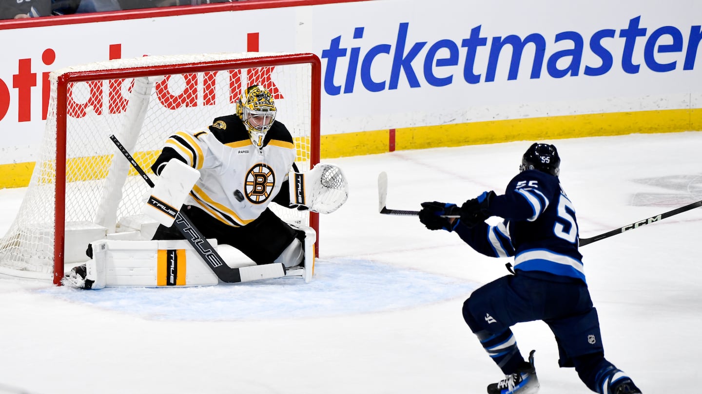 Bruins goalie Jeremy Swayman was beaten soundly by Winnipeg's Mark Scheifele, one of two goals on the night for the Jets center in Tuesday's 8-1 thrashing of Boston in Manitoba. 