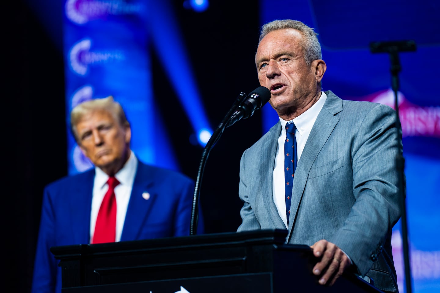 Robert F. Kennedy Jr. spoke with Donald Trump at a Turning Point Action rally in Duluth, Ga., on Oct. 23.