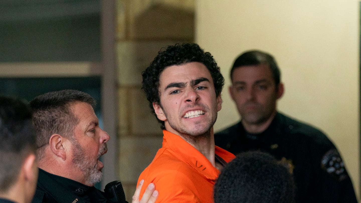 Suspect Luigi Mangione is taken into the Blair County Courthouse on Dec. 10, in Hollidaysburg, Pa.