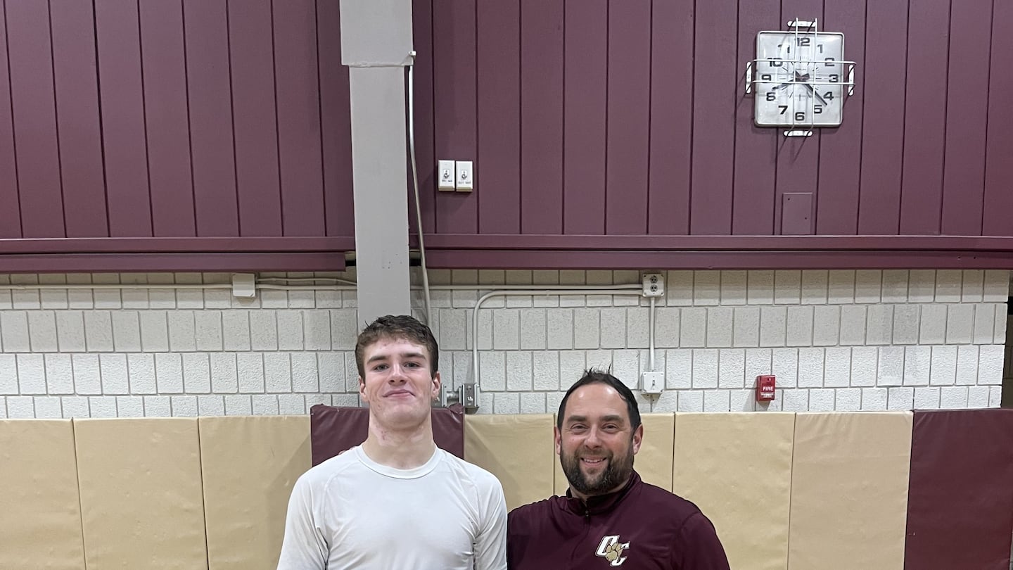 Old Colony senior Max Finney scored his 1,000th point in the Cougars' season opener on Thursday. He is joined by coach Matt Trahan.