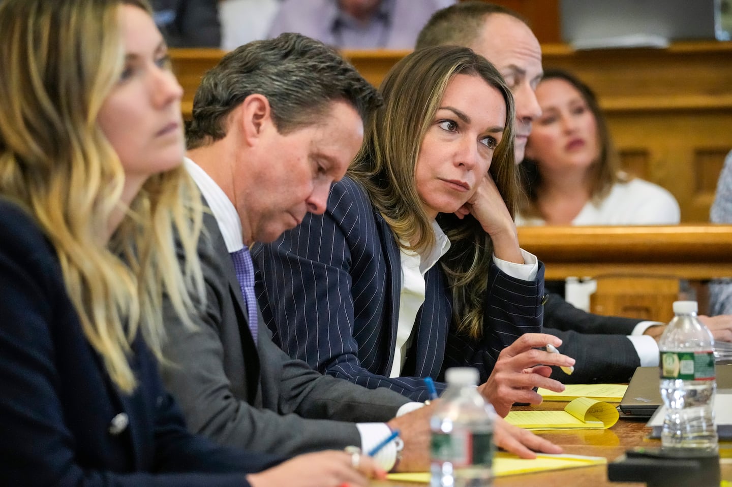 Karen Read, center right, sits at the defense table during her trial in June.