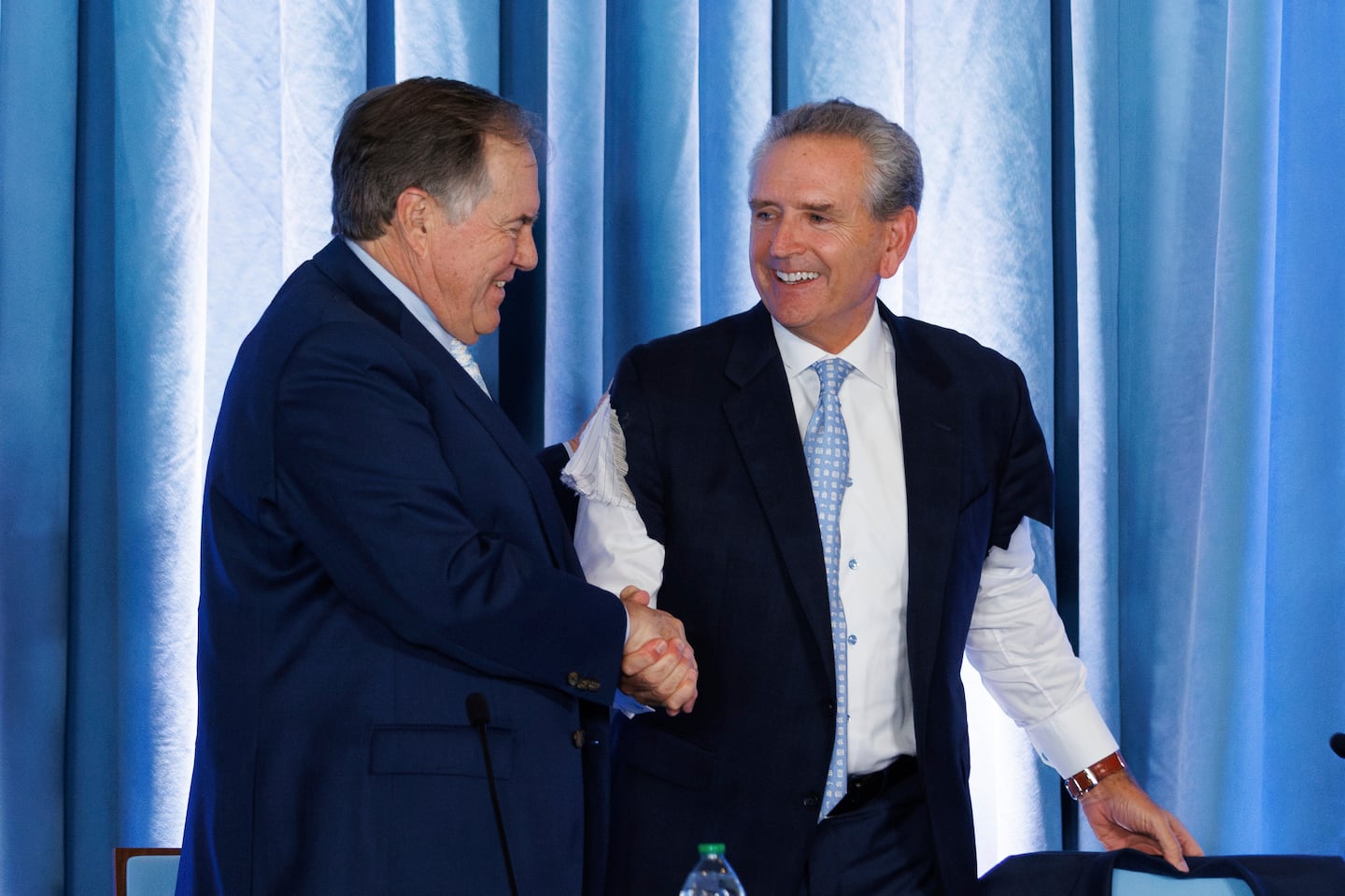 North Carolina athletic director Bubba Cunningham wore a Bill Belichick-style cutoff suit jacket when he introduced Belichick as the Tar Heels' new coach.