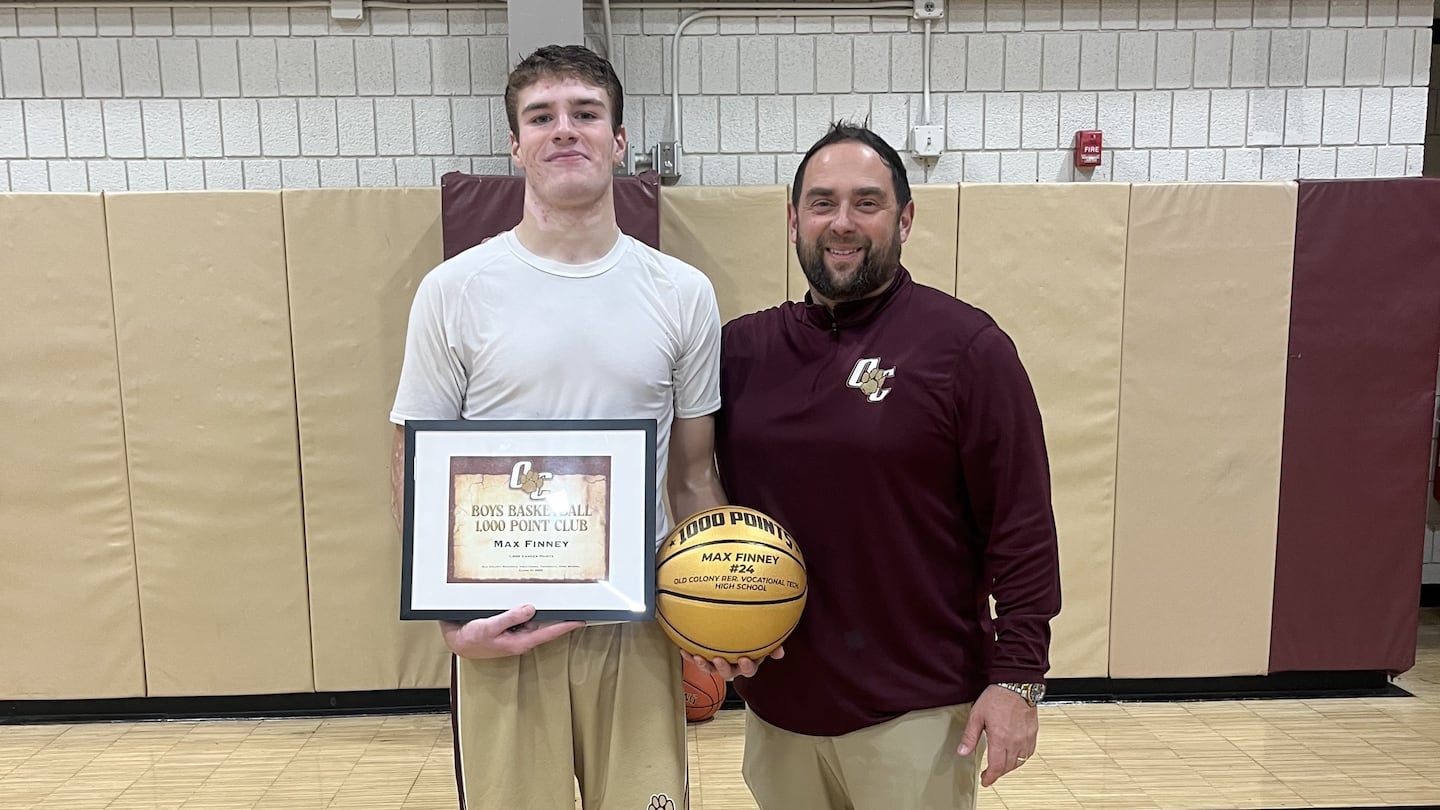 Old Colony senior Max Finney scored his 1,000th point in the Cougars' season opener on Thursday. He is joined by coach Matt Trahan.