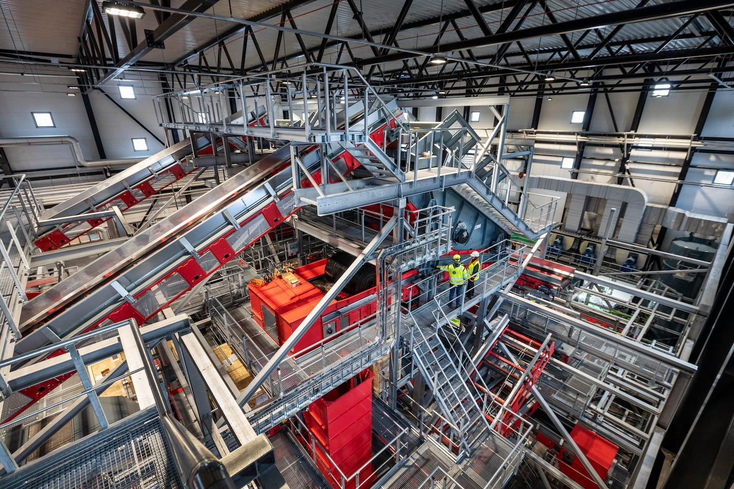 Interior view of the conveyor belts and sorting technology at the Resursutvinning Stockholm, the city's state-of-the-art waste sorting facility that aims to reduce greenhouse gas emissions by separating food scraps and plastics from municipal waste.