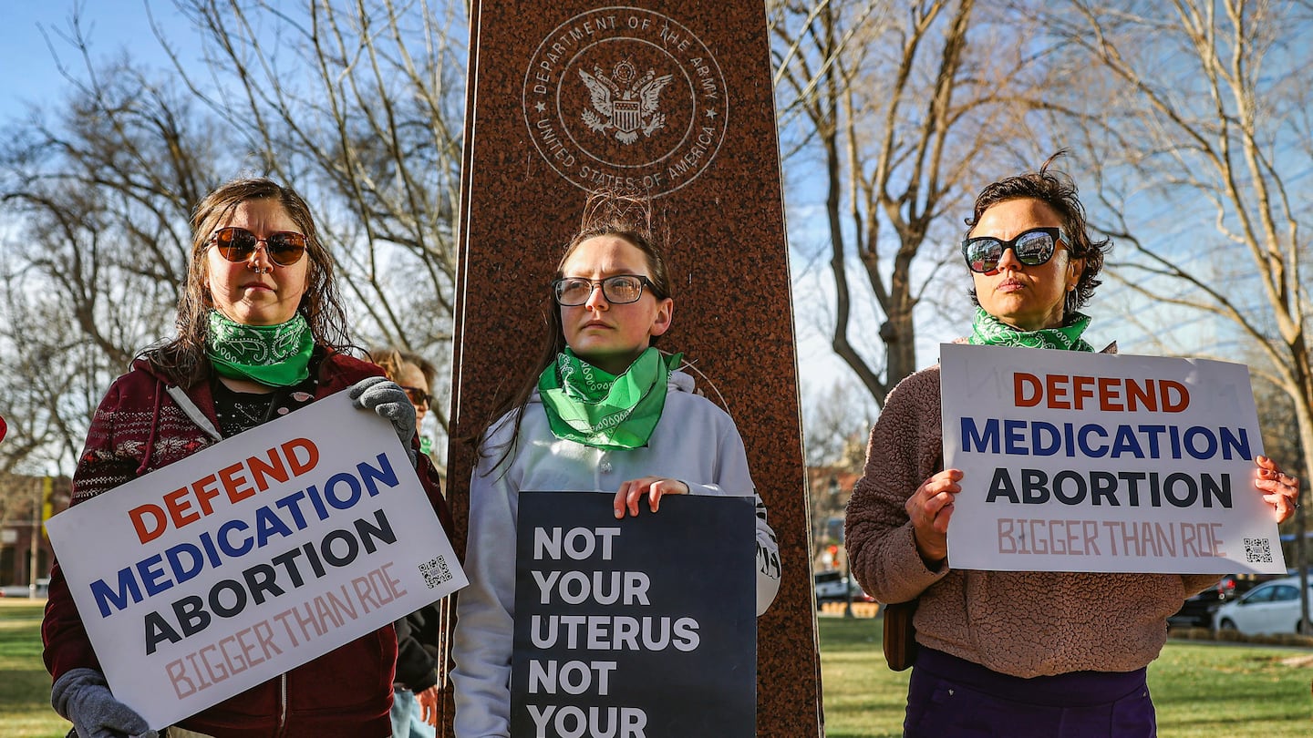 Three members of the Women's March group protested in support of access to abortion medication outside the Federal Courthouse last year in Amarillo, Texas.