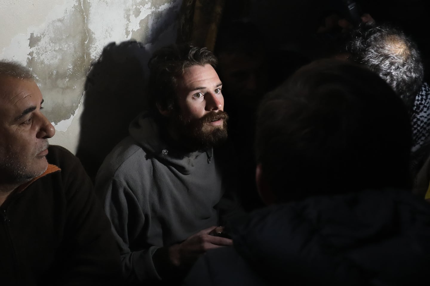 Travis Timmerman, a US citizen who had entered Syria from Lebanon on a Christian pilgrimage and had been detained for several months, speaks with reporters in a house in Damascus on December 12, 2024, after he was found in the village of Thihabiyeh east of the capital, after rebels toppled longtime president Bashar al-Assad.