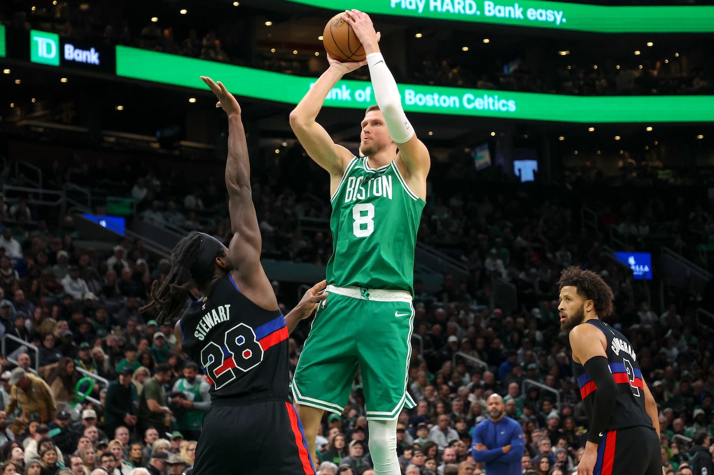 Porzingis scores over Detroit's Isaiah Stewart at TD Garden.