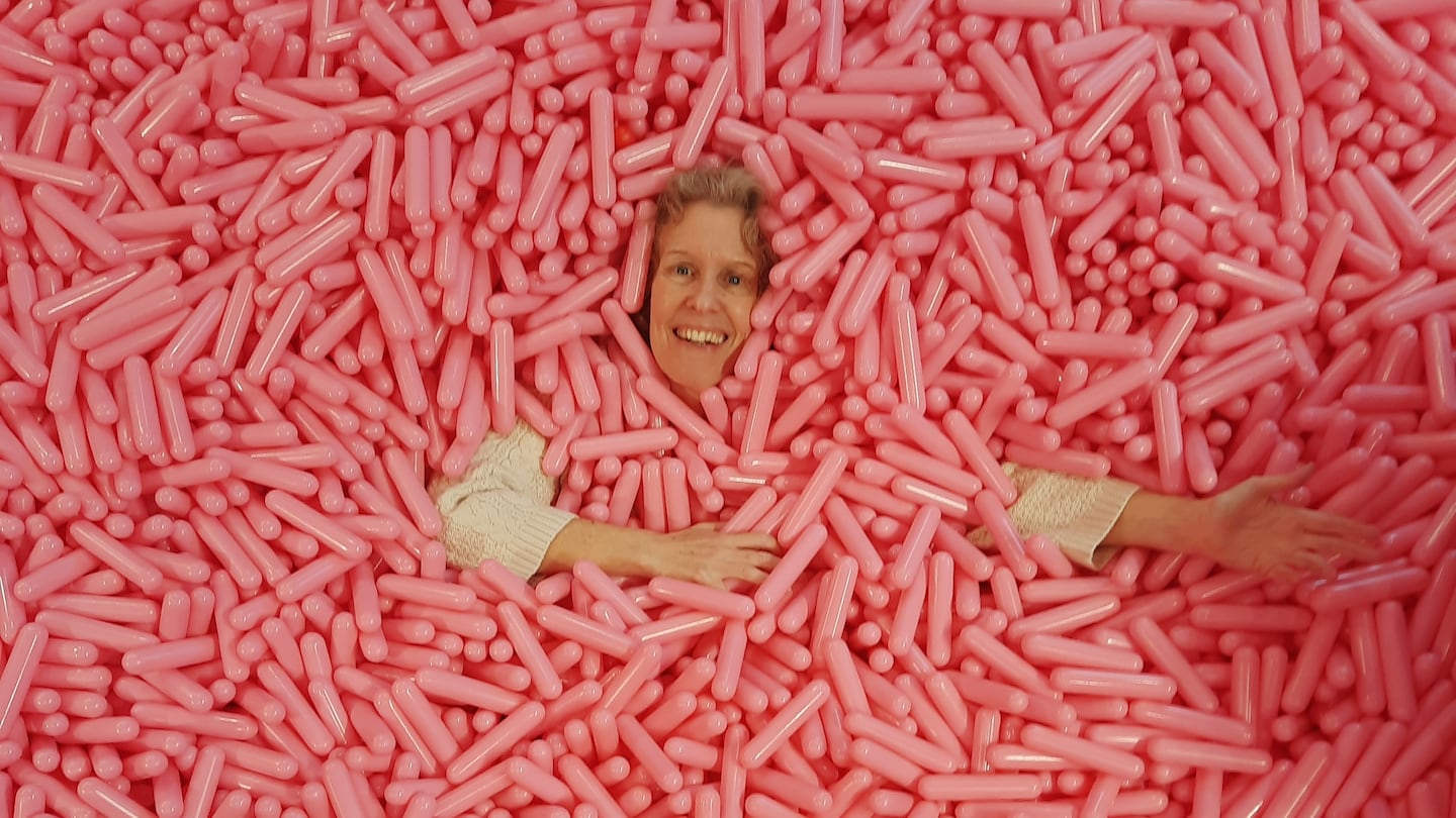 Cate McQuaid in the Sprinkle Pool at the new Museum of Ice Cream location in Boston.