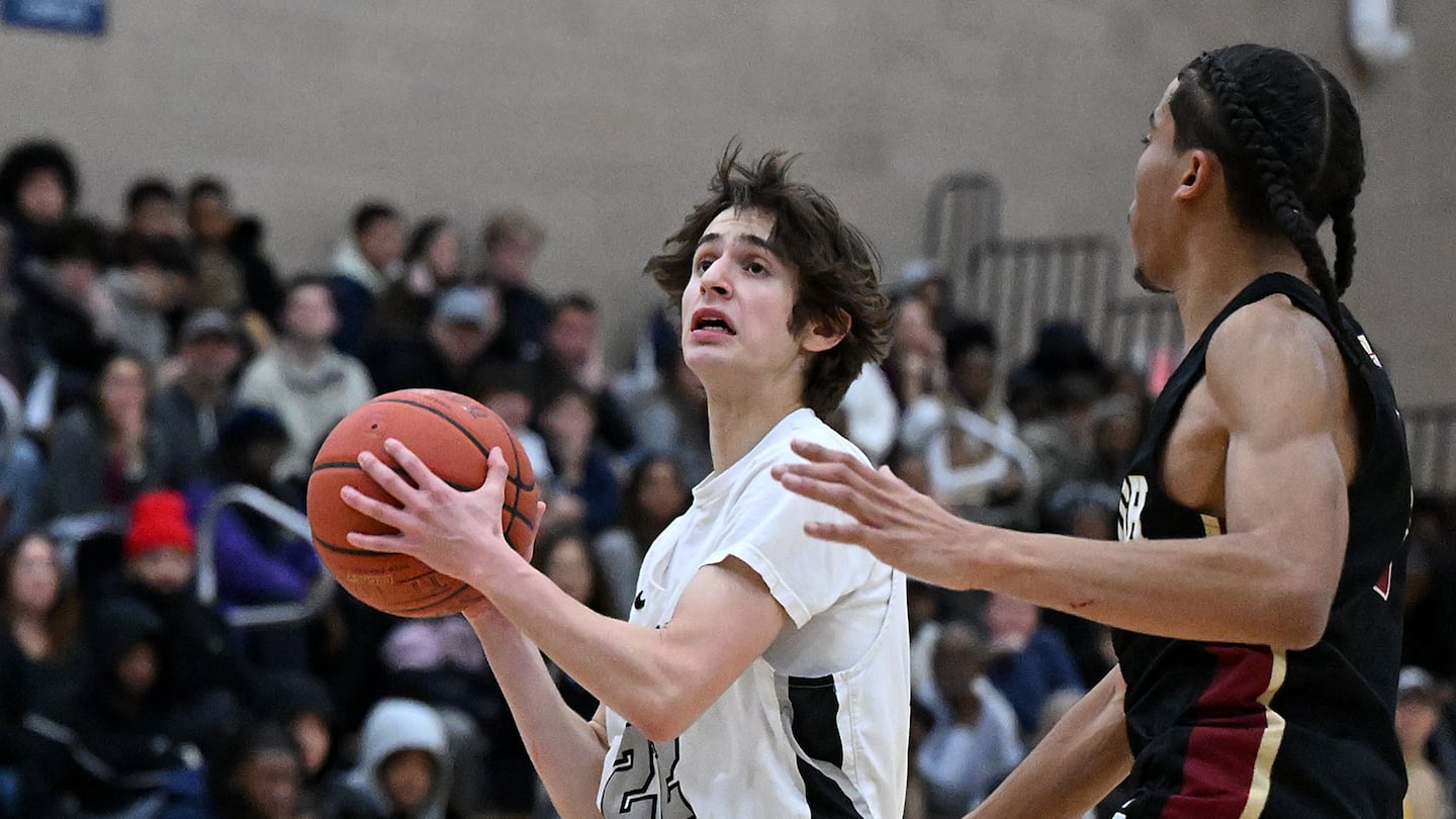 Cambridge junior Itamar Fox (left) scored 12 points in his varsity debut, including 8 in the fourth quarter of a win over BC High.