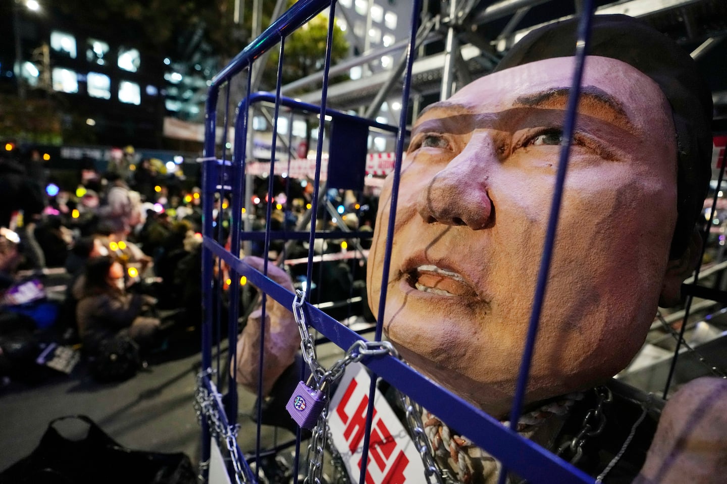 A caricature depicting an imprisoned South Korean President Yoon Suk Yeol is displayed during a rally to demand his impeachment outside the National Assembly in Seoul, South Korea, on Dec. 13.