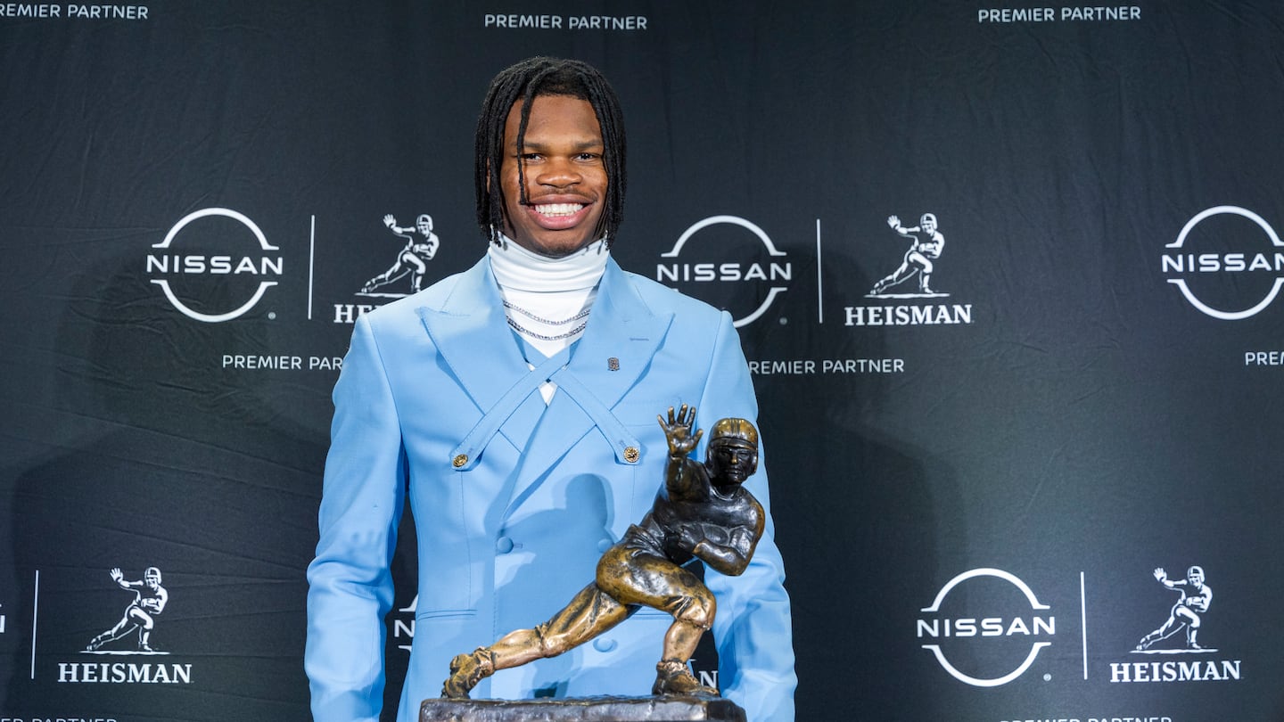 Travis Hunter of the University of Colorado posed with the Heisman Trophy.