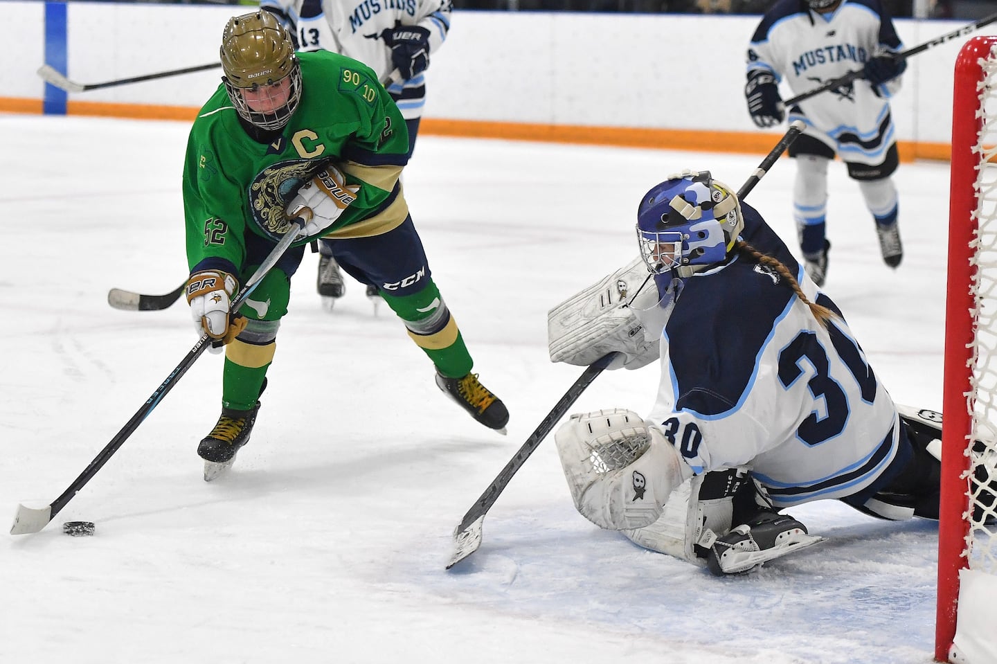 Winthrop's Talia Martucci closes in on Medford goalie Erin Alves and takes the shot that broke the 100-point barrier for the Winthrop senior.