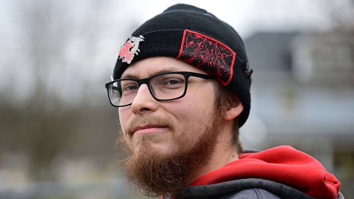 Nicholas Fontaine posed for a portrait outside his home in Akron, Ohio, on Dec. 3. Fontaine is charged with one count of illegal voting.