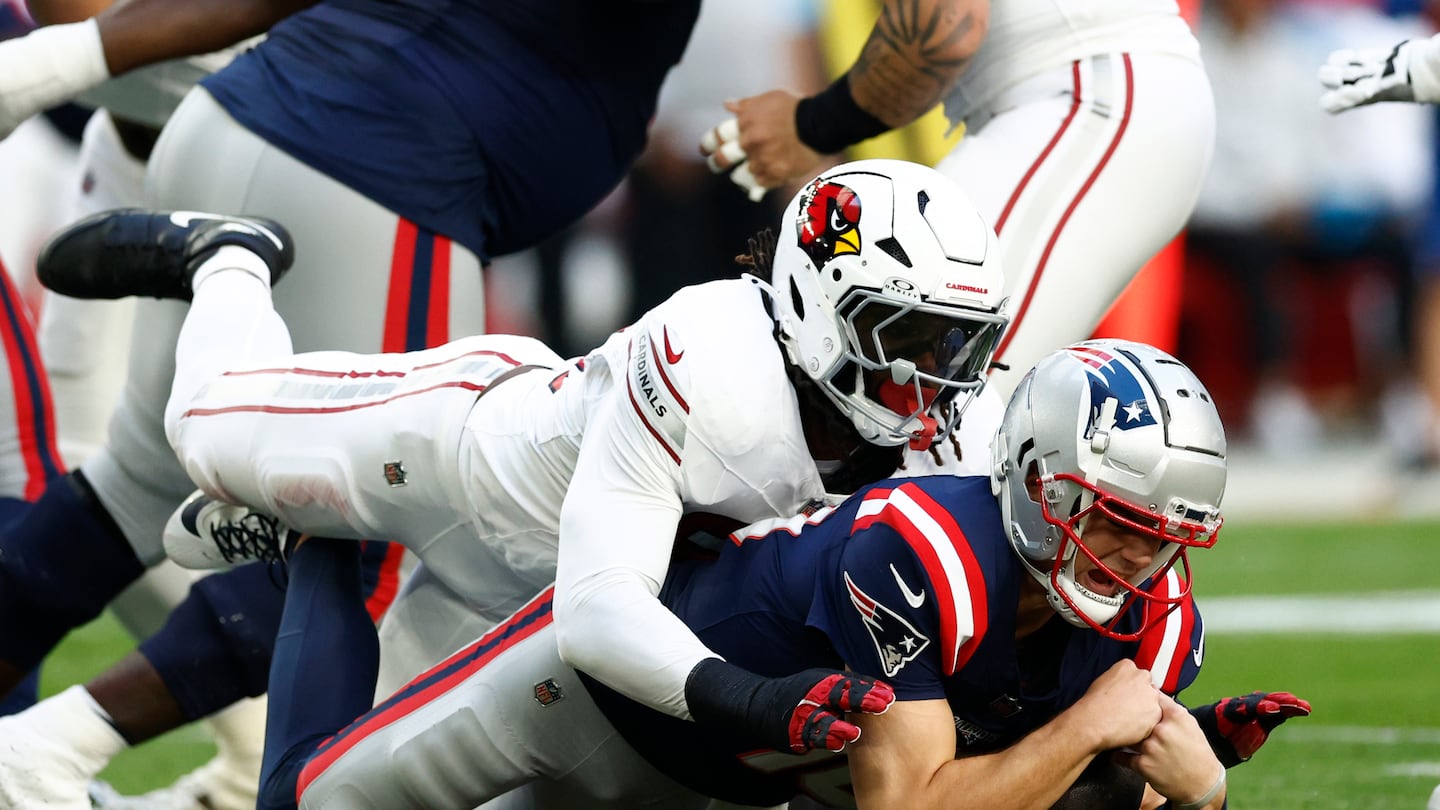 Cardinals linebacker Baron Browning sacks Drake Maye in the first quarter.