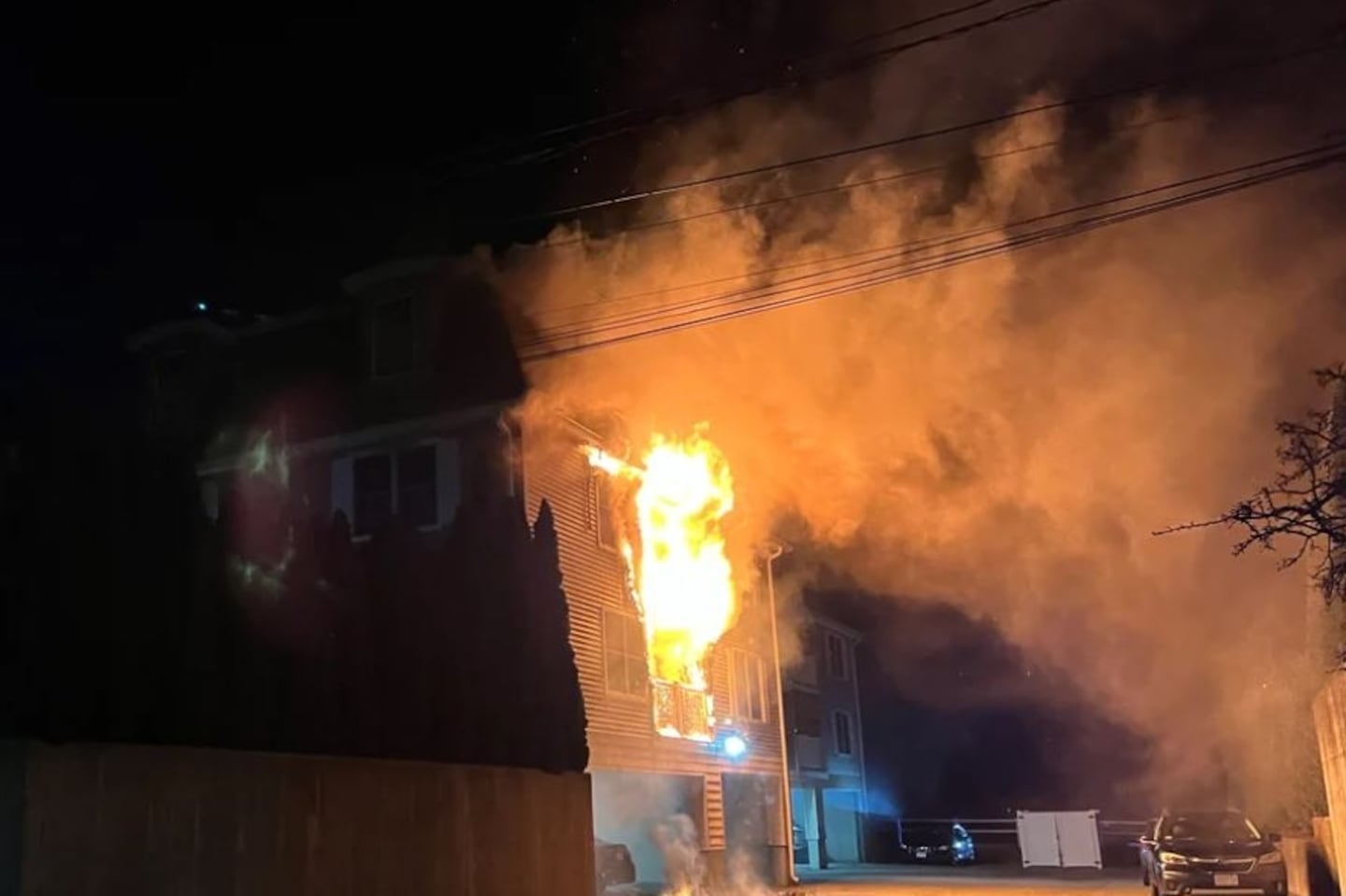 Flames spilled out of the second floor of an apartment building in Gloucester on Saturday night.