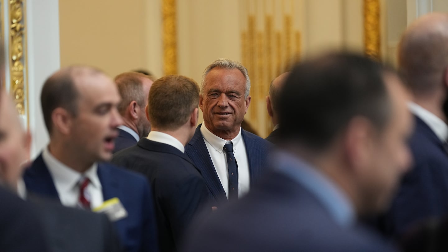 Robert F. Kennedy Jr. at the New York Stock Exchange, where President-elect Donald Trump rang in the day's trading on Thursday.