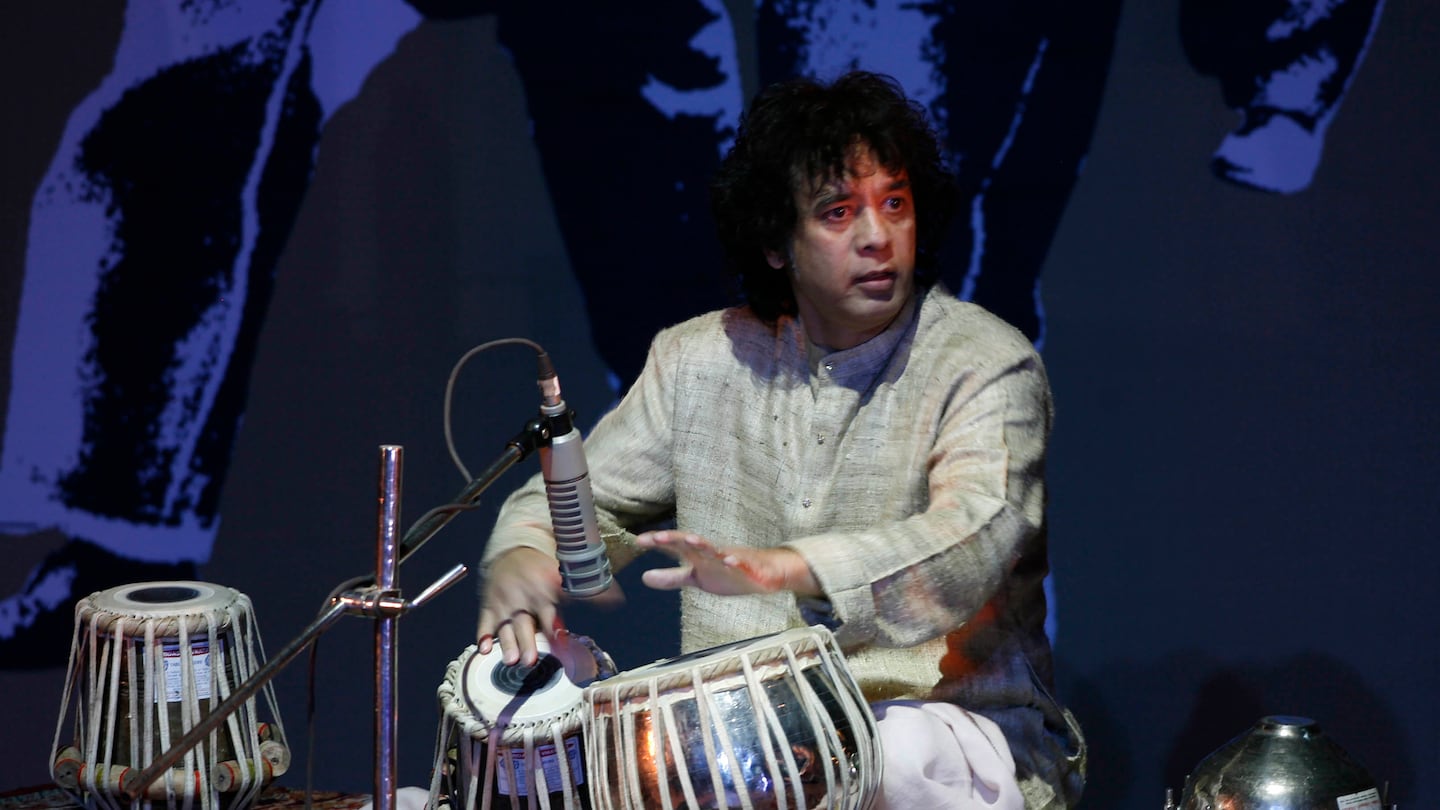 Mr. Hussain performed at the "Living Dream Concert" in New Delhi in 2009.