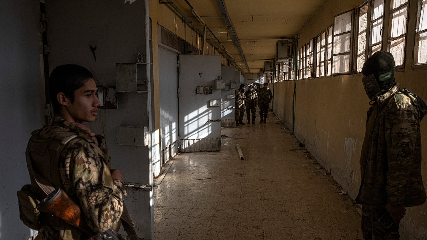 Fighters from a Syrian Turkmen Brigades visit the Sednaya Prison in Damascus, on Dec. 16.