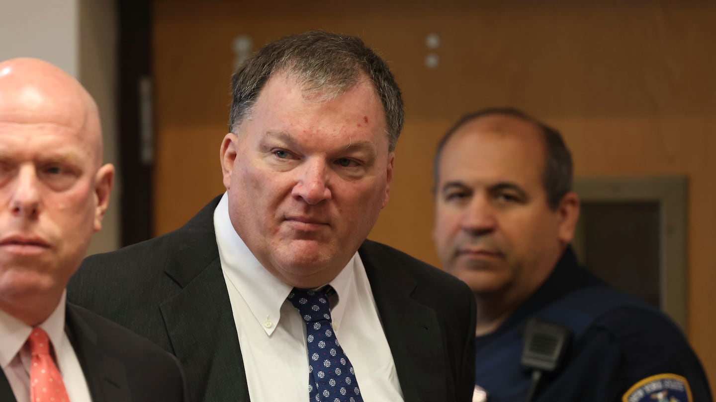 Rex Heuermann, center, charged in the Gilgo Beach serial killings on Long Island, appears for a hearing, July 30, at Suffolk County Court in Riverhead, N.Y.