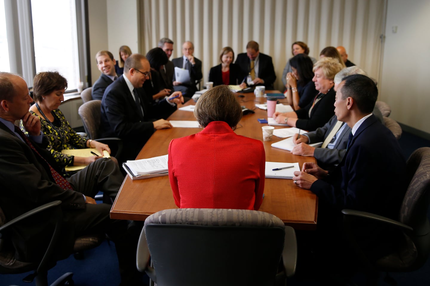 Then-Attorney General Maura Healey (center) met with staff at her office in Boston in September of 2015.