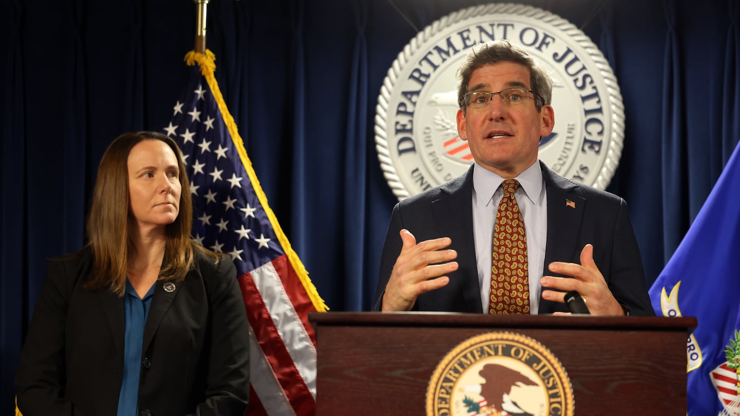 Jodi Cohen, special agent in charge Federal Bureau of Investigation in Boston, listened as Joshua S. Levy, US Attorney for Massachusetts spoke at a press conference on Monday.