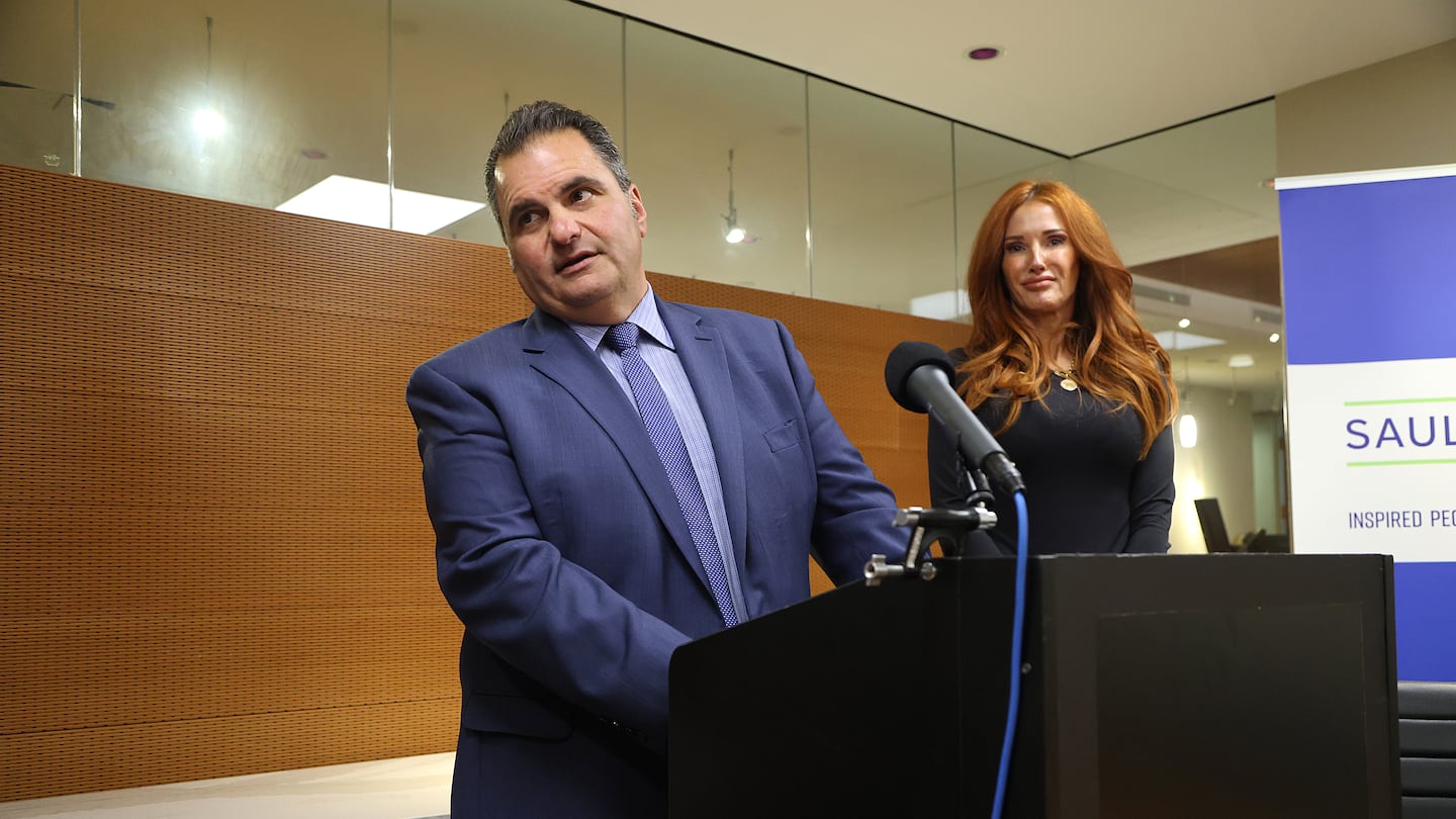 Mayor Carlo DeMaria of Everett and his wife, Stacy, held a news conference at his lawyer’s office to discuss the settlement.