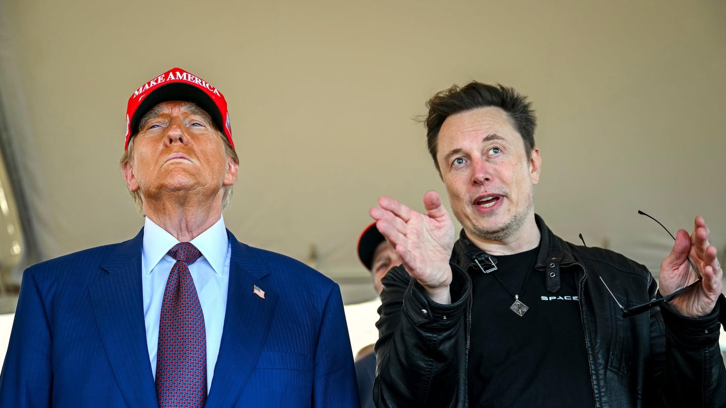 President-elect Donald Trump listens to Elon Musk as he arrives to watch SpaceX's mega rocket Starship lift off for a test flight from Starbase in Boca Chica, Texas, on Nov. 19.