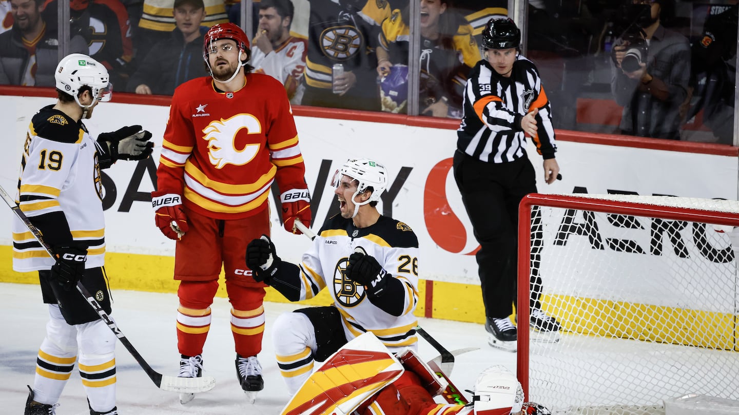 Marc McLaughlin (center) made it two goals in two nights, tying Tuesday's game in Calgary in the third period when he nosed the puck around Flames goalie Dustin Wolf.