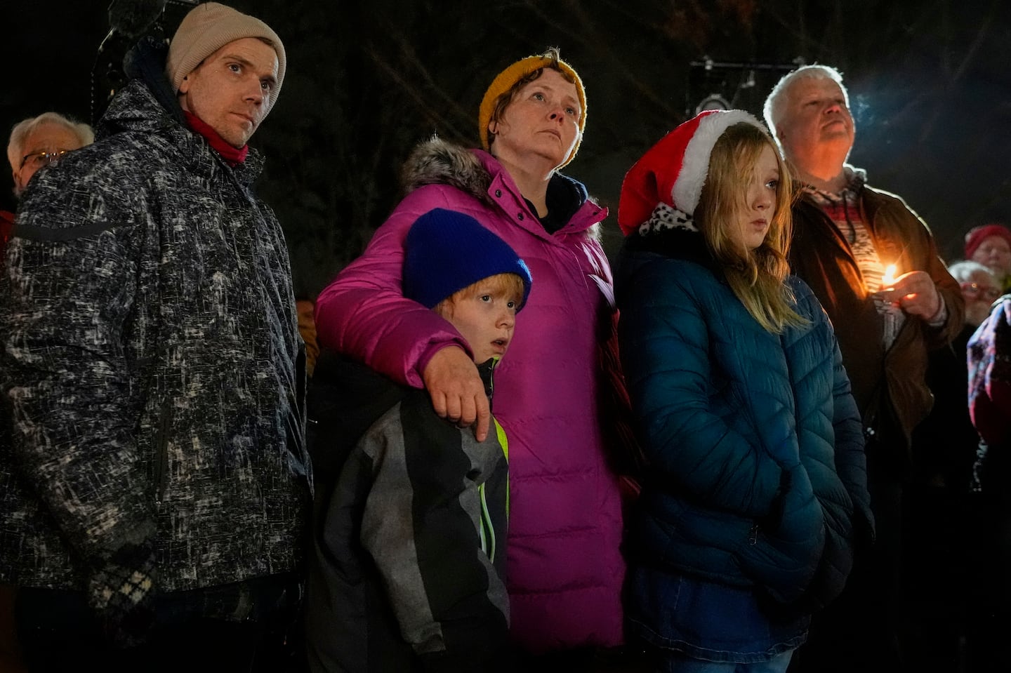 Supporters hold candles during a candlelight vigil Dec. 17, outside the Wisconsin Capitol in Madison, Wis., following a shooting at the Abundant Life Christian School on Monday.